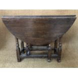 An early 18th Century joined-oak gate leg table of diminutive stature, 90 cm x 91 cm x 67 cm high