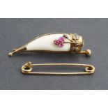 An antique 9 ct gold stock or safety pin, 4 cm, 1.5 g, together with a Victorian yellow metal