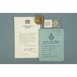 A 1940s RAF Service & Release Book together with cap badge, King's Badge and issue document