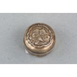 An Edwardian silver pill or similar box, the domed lid embossed in depiction of a young woman and