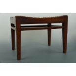 An Arthur Simpson Kendal Arts and Crafts oak stool with interlaced hide seat, 40 cm x 30 cm x 30