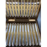 Cased sets of cutlery including 5 silver tea spoons with sugar tongs, silver-handled tea knives,