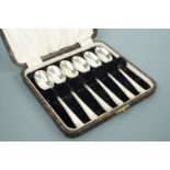 A cased set of six Art Deco influenced silver tea spoons, C W Fletcher & Son Ltd (Charles William