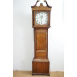 A late Georgian long case clock of uncommon diminutive stature, being an oak-cased 30-hour clock