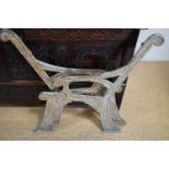 A pair of Victorian Egyptianate cast iron garden bench ends