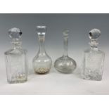 A Scottish Brewers decanter, a Buck Hotel decanter and two others similar