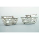 A pair of Victorian silver basket-form bon bon dishes, with folding handles, maker's mark