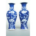 A pair of Chinese porcelain blue-and-white hawthorn and prunus vases, 26 cm