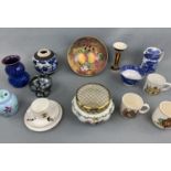 A quantity of ceramics including a 1977 hand-painted bowl by Diane Wallace, a lidded jar, a