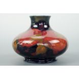 A Moorcroft Pomegrante pattern compressed baluster vase, 8 cm