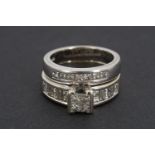 An 18ct white gold and diamond wedding ring set, comprising engagement ring and wedding band, the