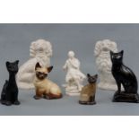 A Louis Wayne type cat figurine together with a pair of Staffordshire dogs (a/f), three similar