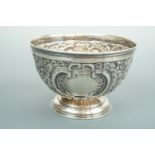 An Edwardian silver footed bon bon dish, of hemispherical form, with dense repousse moulded and