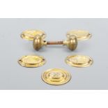 Four early 19th Century stamped brass furniture bale handle backplates depicting game shooting,