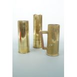 Three Great War trench art shell cases including a 1917 dated example engraved in depiction of a