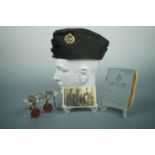 A Second World War RAF service cap together with a portrait photograph, documents and identity