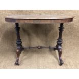 A Victorian lady's walnut oval writing table