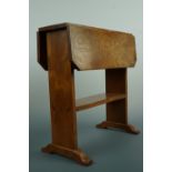 An early 20th Century Arts and Crafts elm drop-leaf occasional table, the mortise and tenon joints