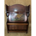 A George V Arts and Crafts parquetry-inlaid mahogany wall-hanging shelf and magazine rack, 51 cm x