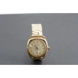 A 1950s Avia 9 ct gold wristwatch, on associated plated bracelet strap, (running)