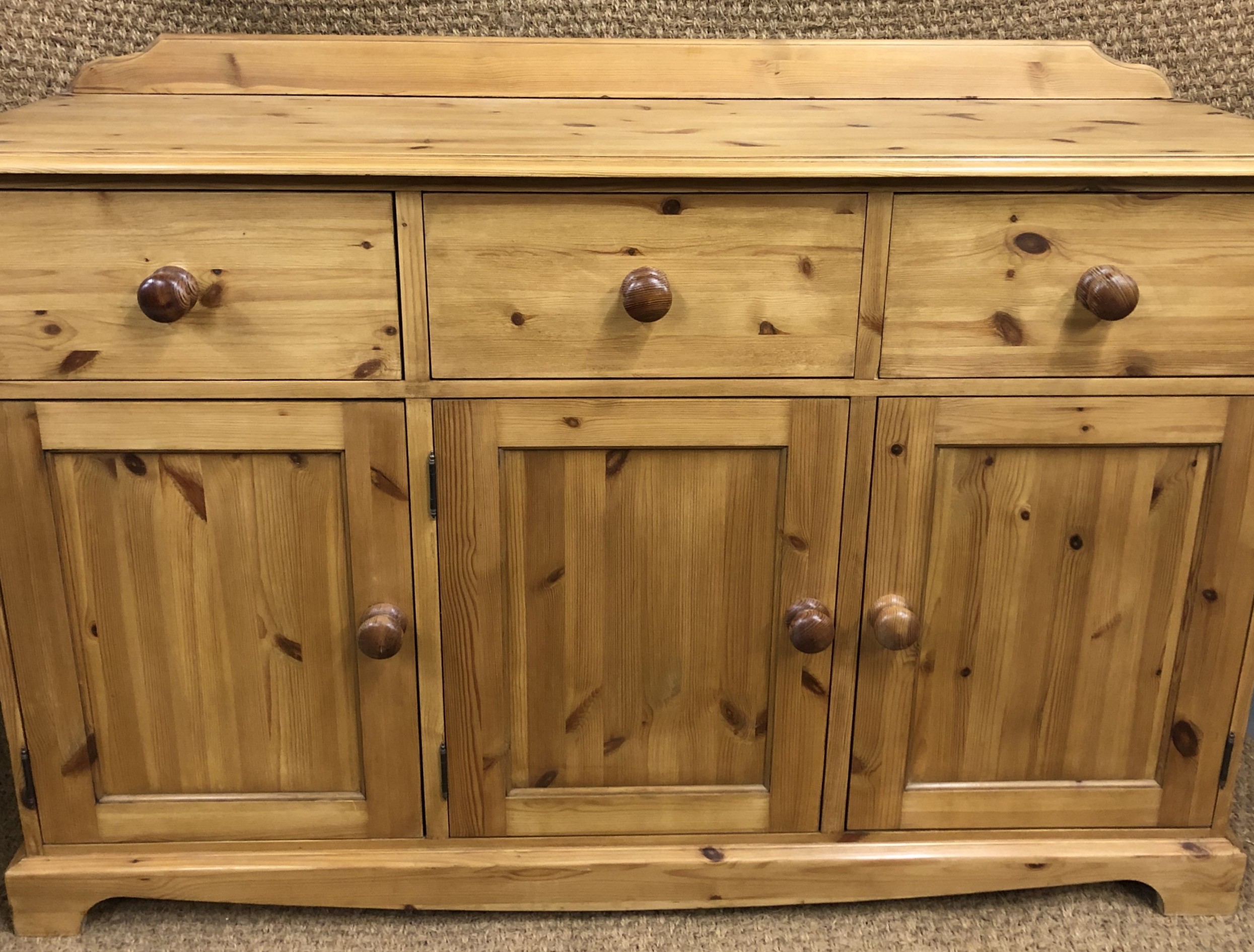 A contemporary pine sideboard, 141 x 43 x 96 cm