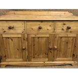 A contemporary pine sideboard, 141 x 43 x 96 cm