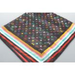 A Louis Vuitton scarf, with repeating logo in rainbow colours over a black ground, 100 x 100 cm