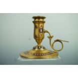 A late 19th Century French champleve enamelled gilt brass chamberstick by Ferdinand Barbedienne,