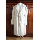A 1940s lady's ermine coat, with stepped collar, 20" across back