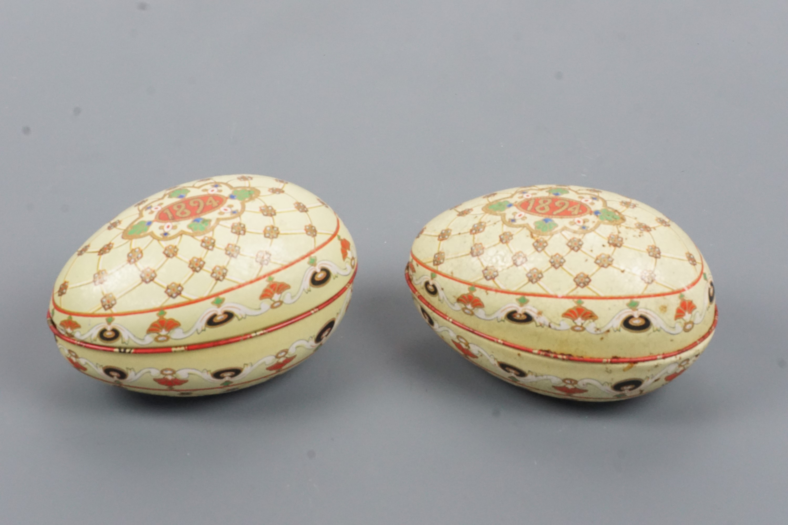 Two reproduction printed tinplate 1894 Easter egg boxes, 21 cm