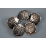Five Victorian livery buttons bearing an armorial crest in the form of a hand grasping the