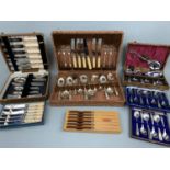 Two cased sets of cutlery, a cased dessert set, two cased sets of teaspoons, boxed butter knives and