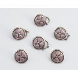 A set of six early 20th Century Arts and Crafts enamelled white metal waistcoat buttons, each pink