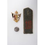 An Imperial German 110th Regiment other rank's shoulder strap, a tunic button and a naval lapel