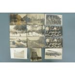 A small quantity of Great War photographic postcards including German troops marching French