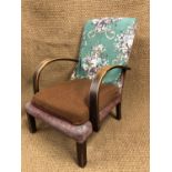 A 1930s upholstered open armchair