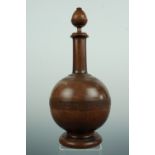 [ Treen ] A 19th Century turned walnut or similar hardwood decanter, 33 cm