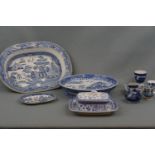 A blue-and-white willow pattern ashet, a willow pattern stand, blue-and-white butter dish etc.