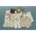 A quantity of Victorian doll's costume, including a printed cotton sun bonnet, three straw hats, and