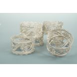 A set of six Anglo-Indian white metal filigree napkin rings, tested as silver, 89.6g