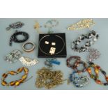 A large quantity of costume bead necklaces, bangles etc including a near contemporary cased collar