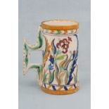 A late 19th early 20th Century faience tankard, 20 cm high