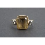 A Georgian finger ring, comprising a large emerald-cut citrine coloured stone, bezel set above and