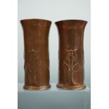 A pair of Keswick School of Industrial Art copper slender spill or flower vases, each cylindrical