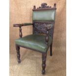 A set of 11 late 19th / early 20th Mannerist-influenced green hide upholstered and carved oak dining
