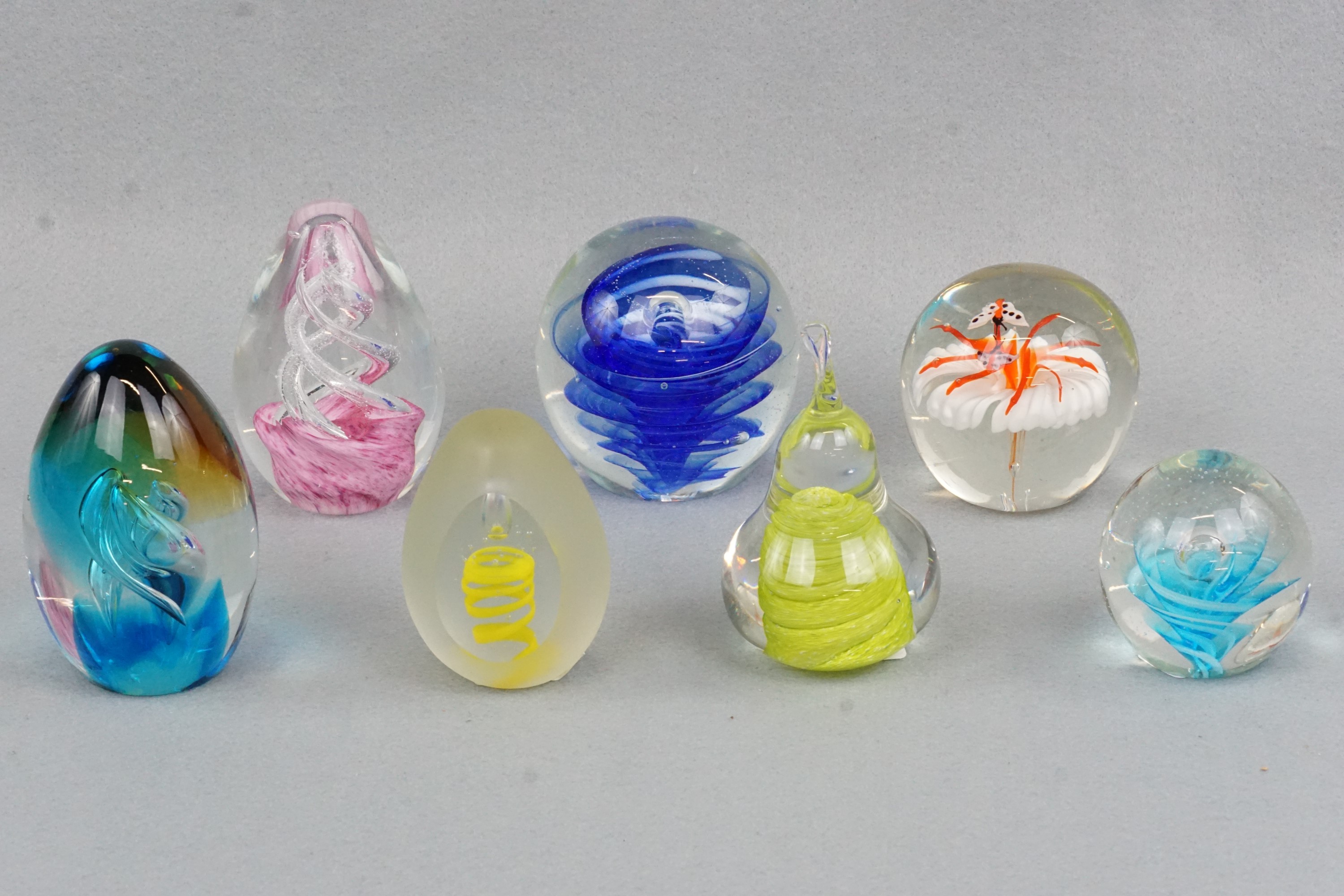 Seven various paperweights