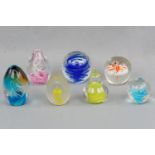 Seven various paperweights