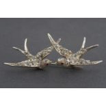 A Belle Epoque paste set gilt white metal brooch in the form of a pair of swallows, pave set, with