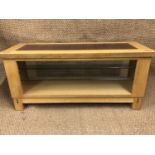 A contemporary light oak coffee table, 110 x 40 x 51 cm