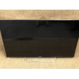 A Sony Bravia TV, model number KDL - 50W829B with remote control